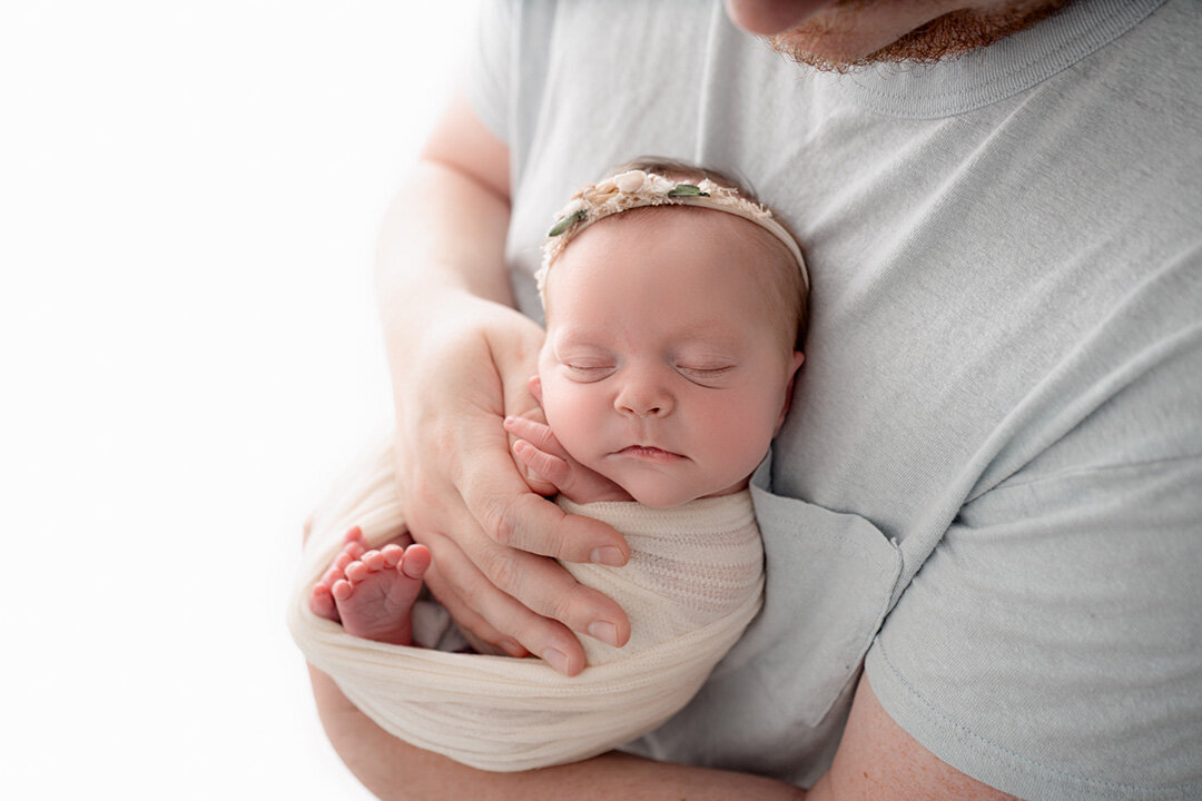 Grand Rapids Newborn Photography Dad Holding Wrapped Baby by For the Love of Photography