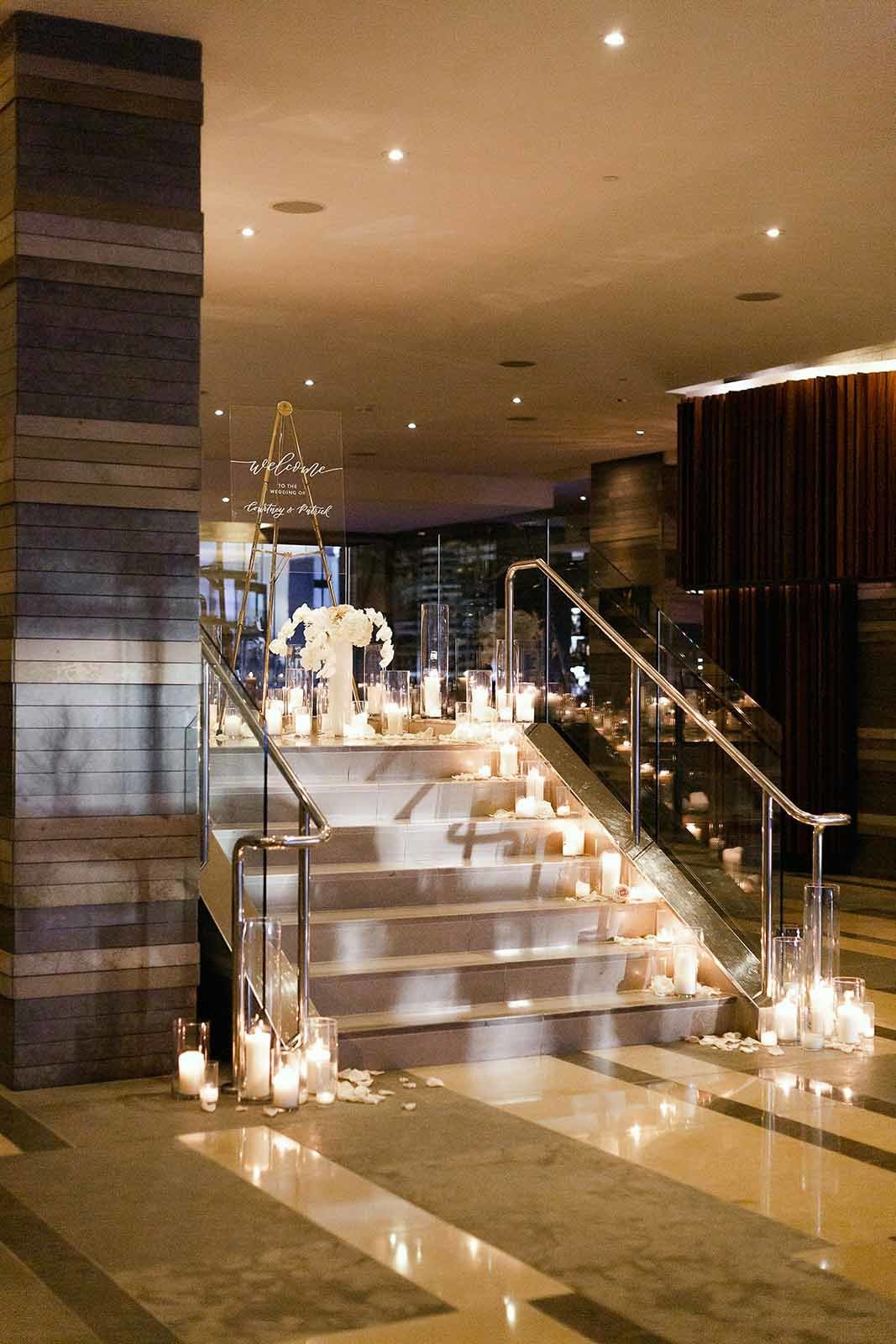 candles lining stairs to Four Seasons ballroom in Seattle