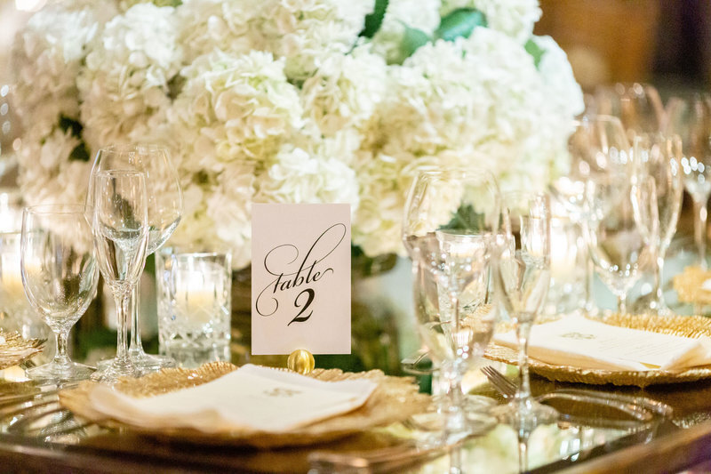 table-number-gold-details-white-hydrangeas-amaryllis