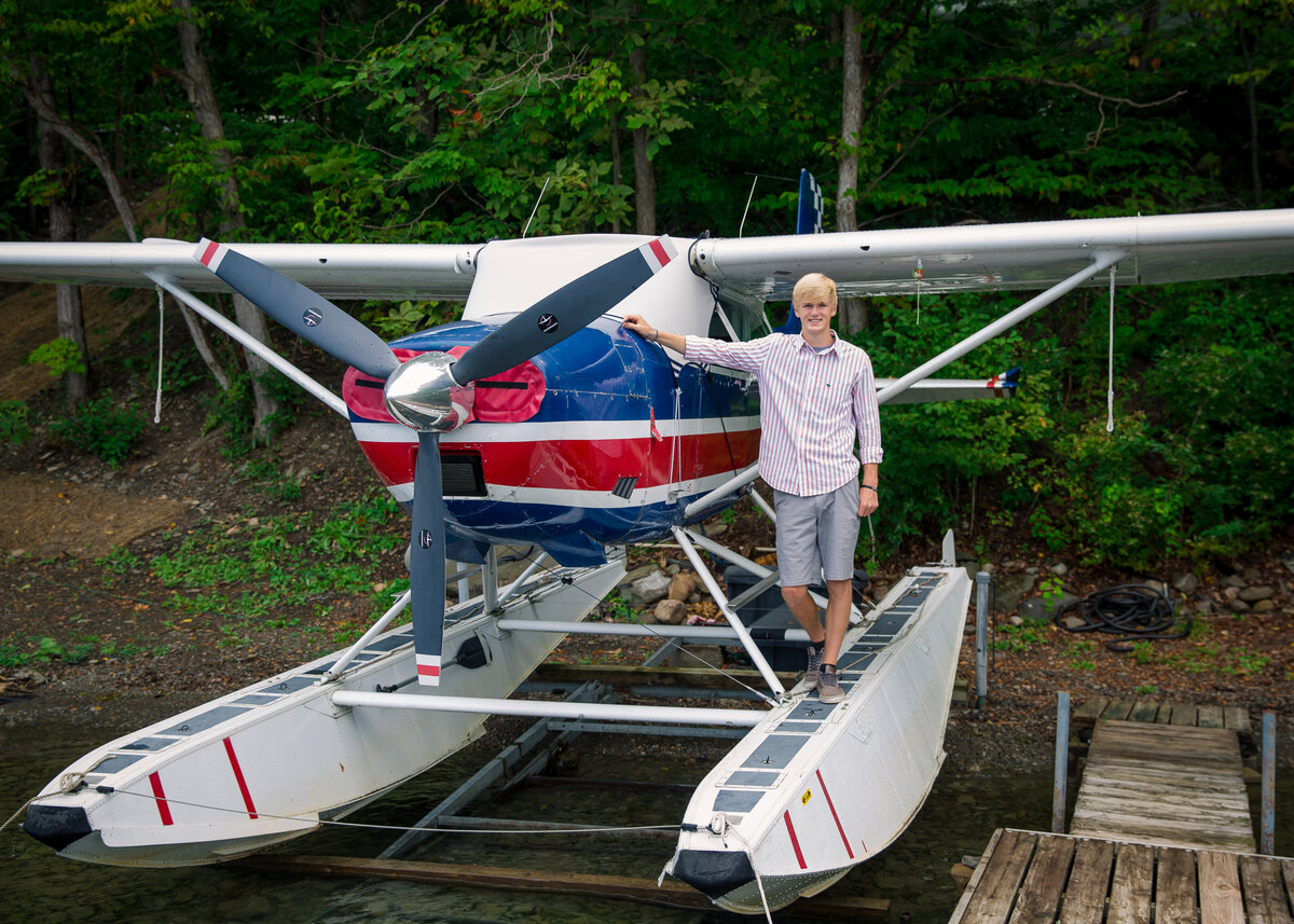 Guy with his sea plane ultimate senior portrait experience