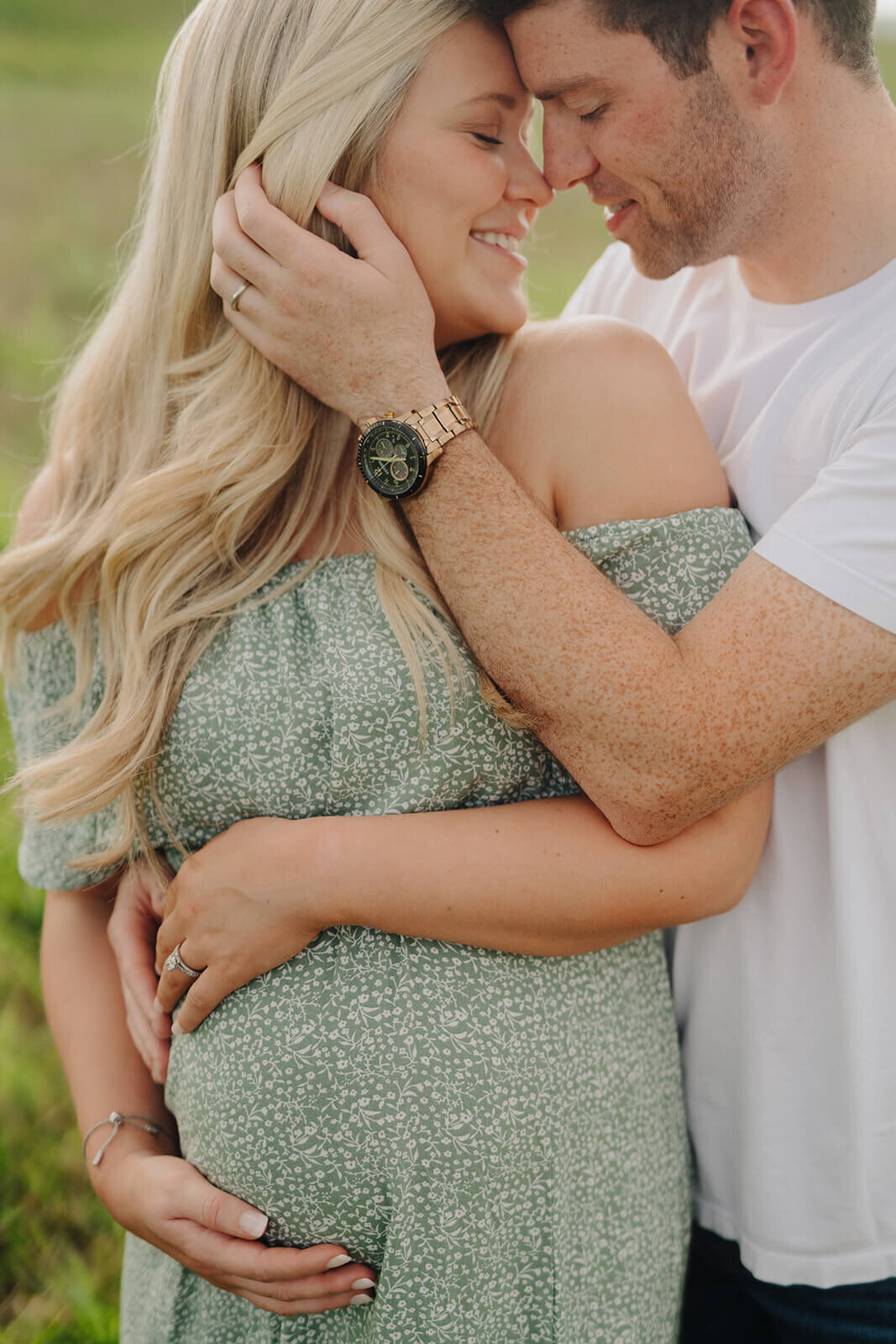 Couple hugging at  maternity session in Finger Lakes, New York
