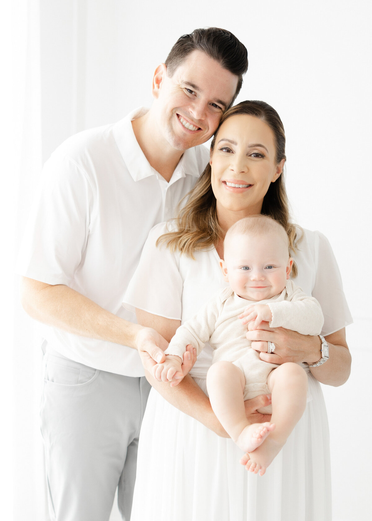 Family portrait of mom dad and baby by family photographer in Northern Virginia