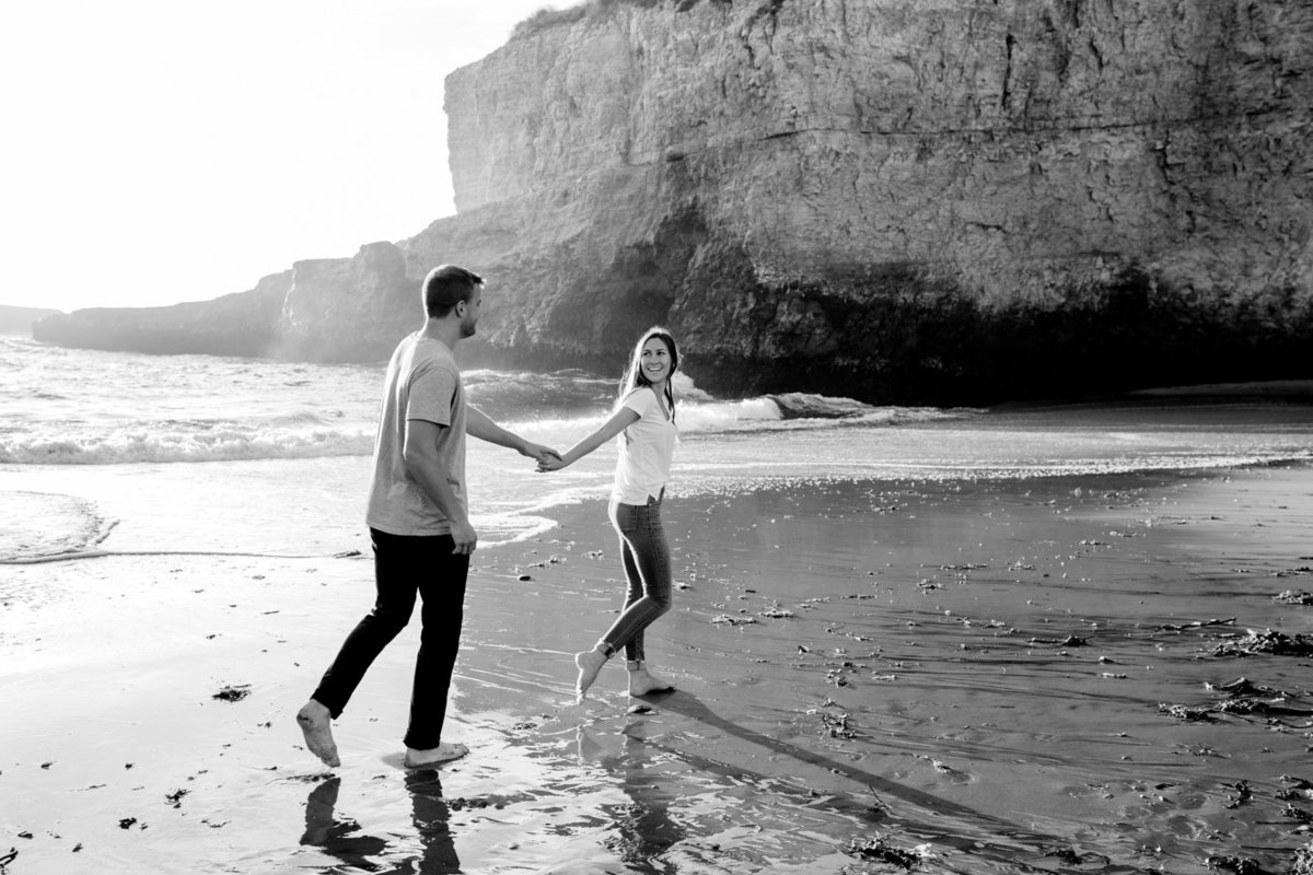 Engagement session for young couple, dramatic portraits natural light on beach