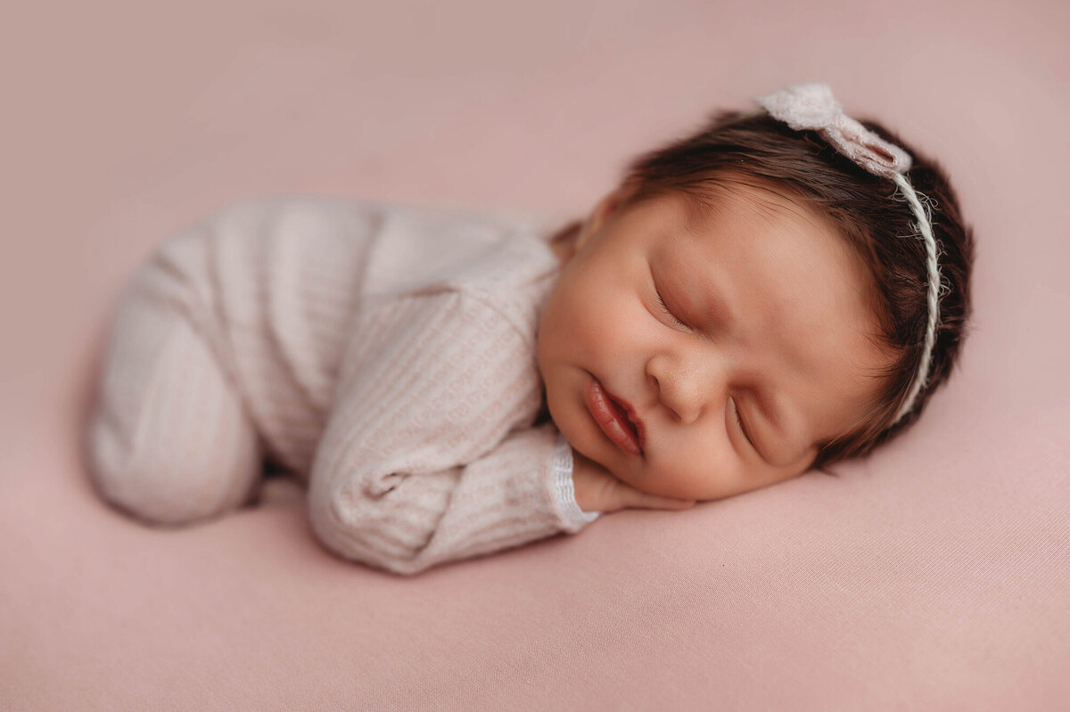 Infant posed for Newborn Photoshoot in Charleston, South Carolina.