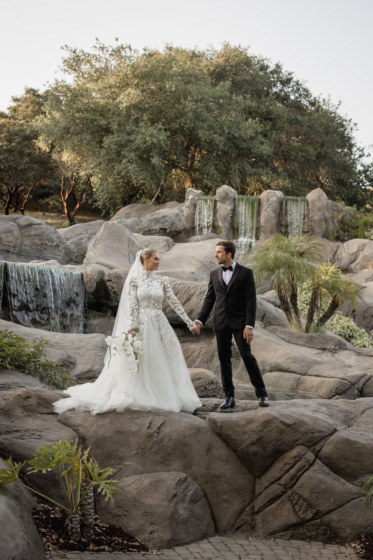 Bride and groom in an editorial-style wedding portrait at Villa Loriana in Arroyo Grande, featuring luxury bridal hair and makeup by Veil Agency.