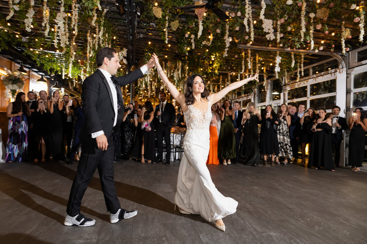 sarah and mark enter their wedding reception at chelsea piers