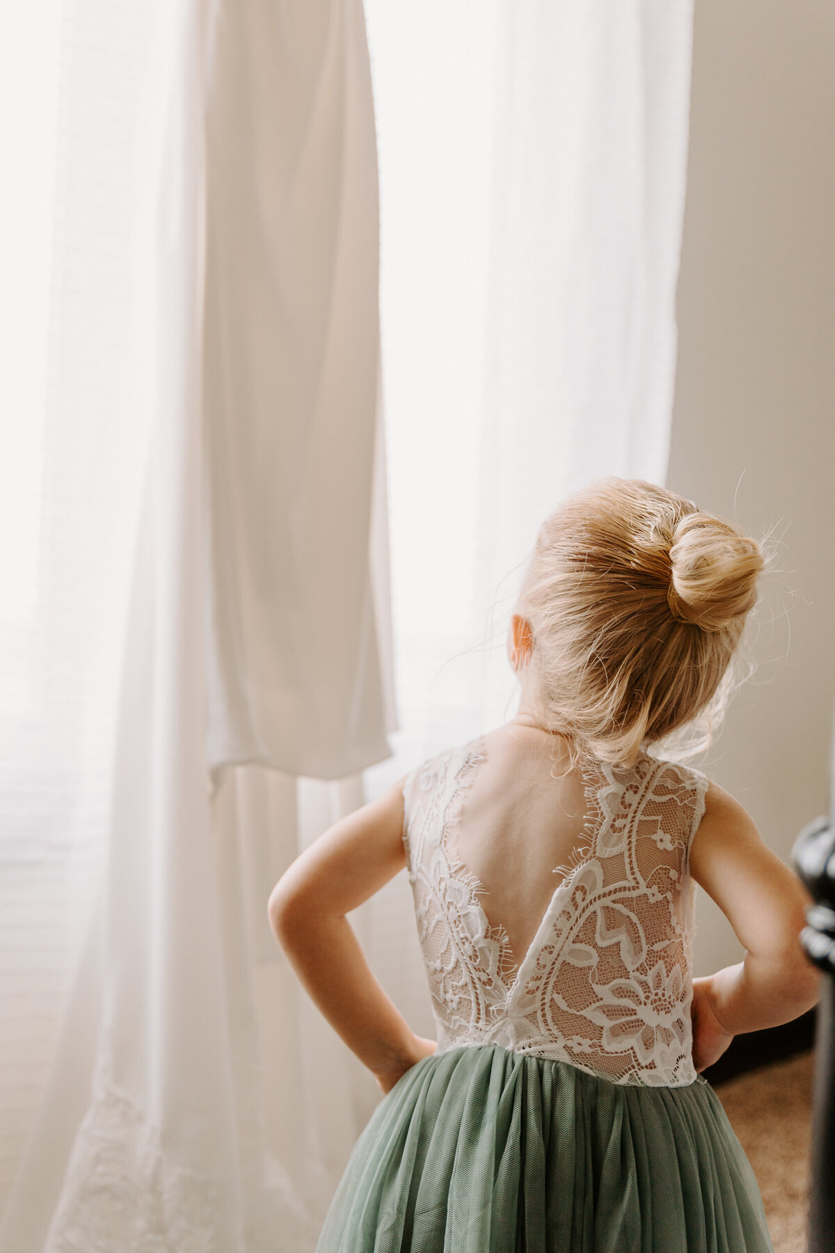 A young girl looking at a wedding dress