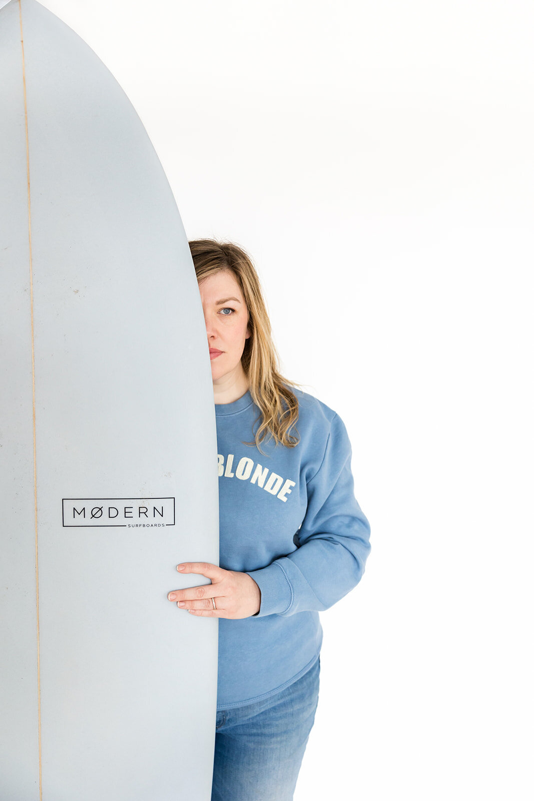 woman surfer holding surfboard