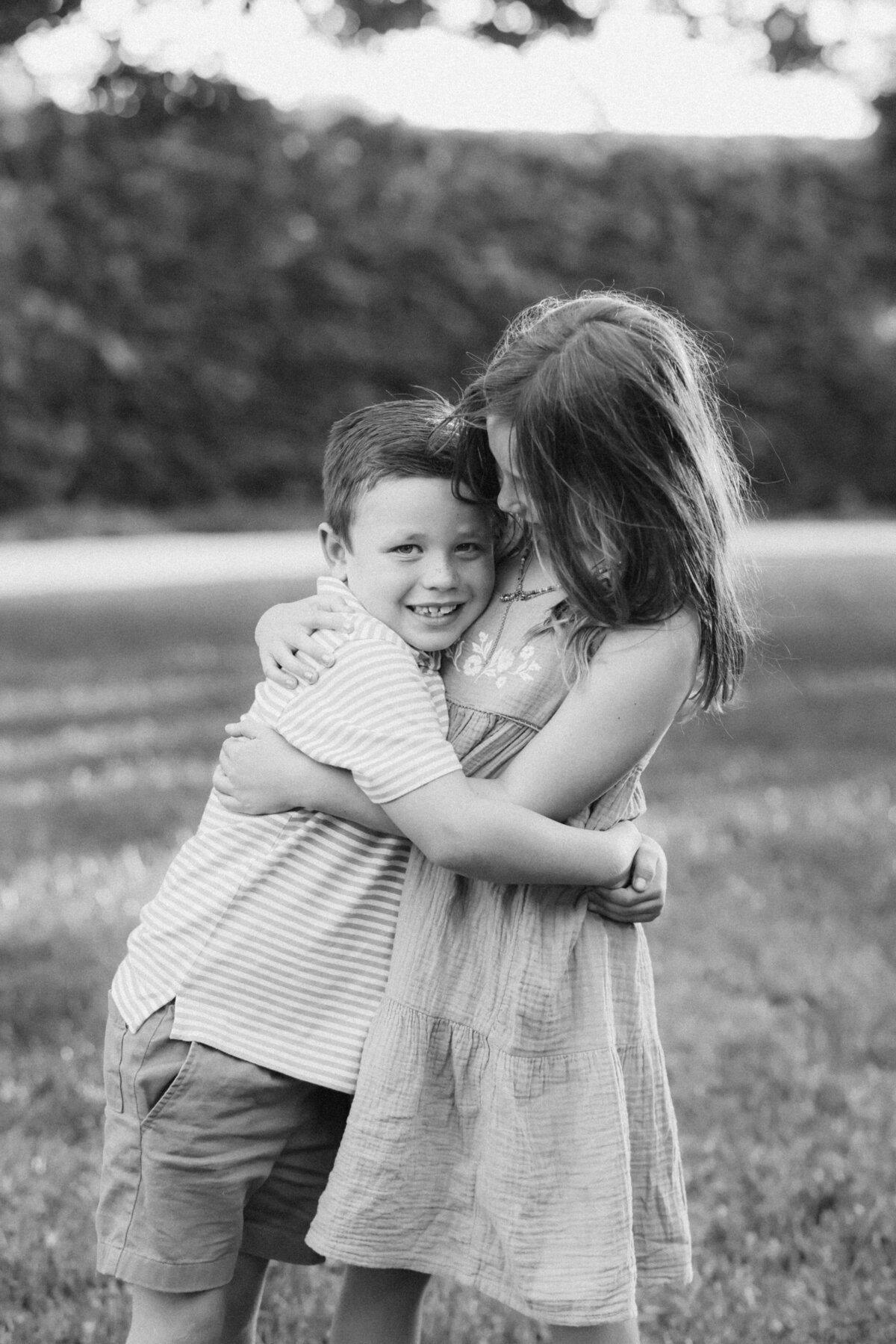 black and white editorial kids hugging