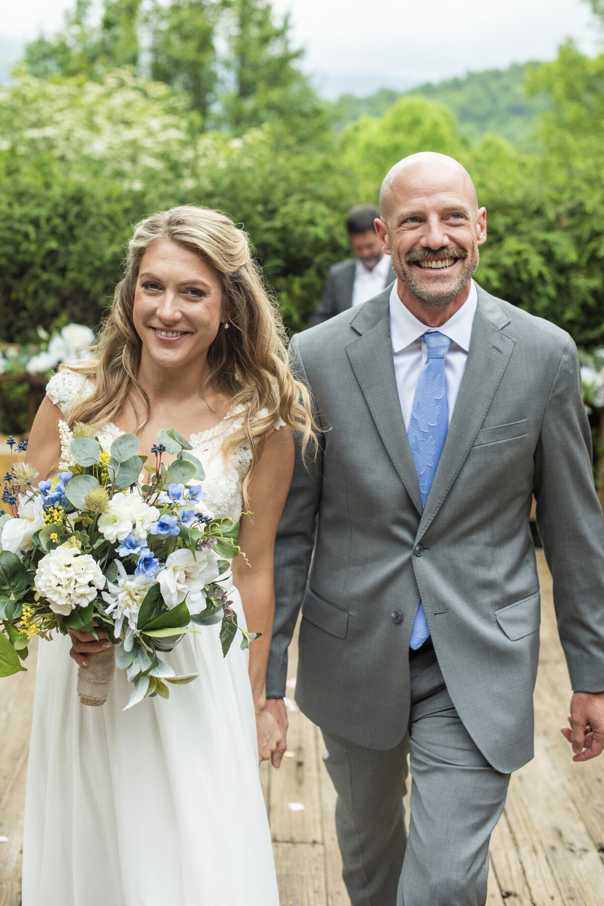 Couple recessing during wedding at Mount Mitchell Eco Retreat