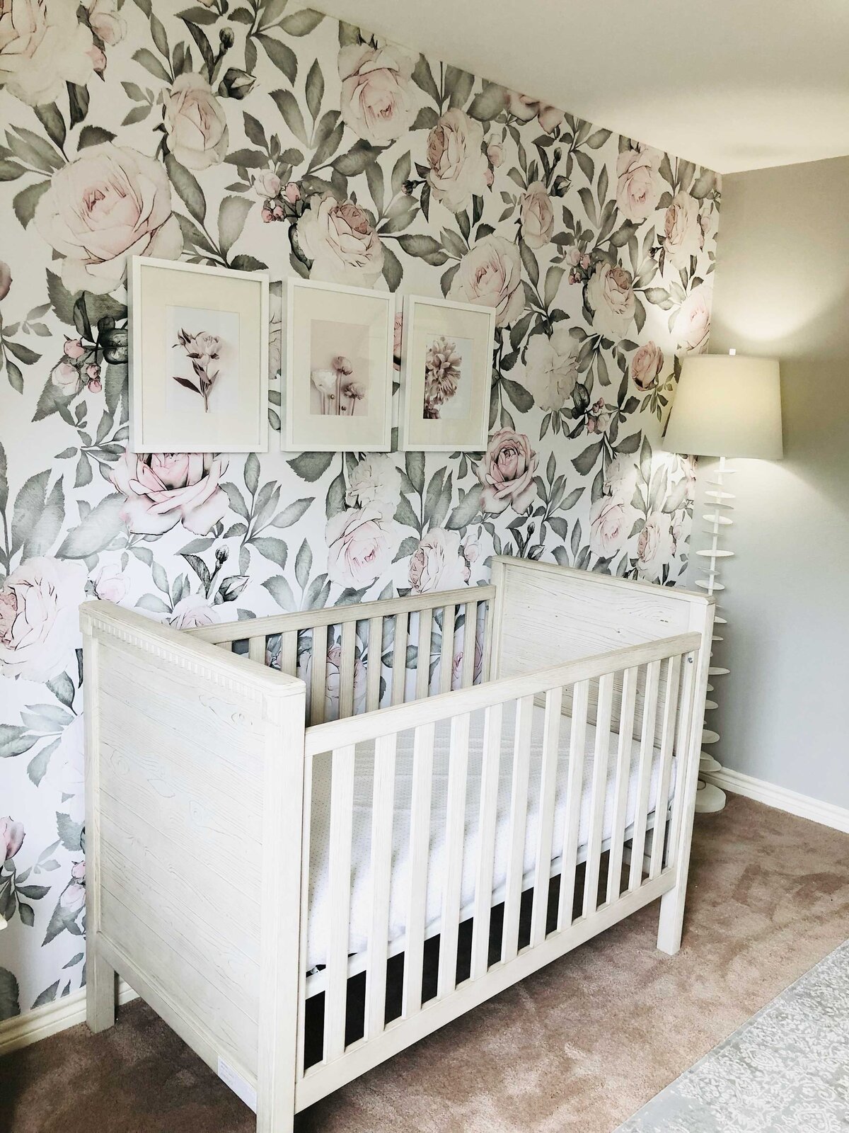 Contemporary home interiors project for a newborn bedroom, featuring pastel grey colors that reflect love and elegance. The room is equipped with a crib and decorated with playful cartoon-themed artwork, creating a warm and inviting atmosphere.