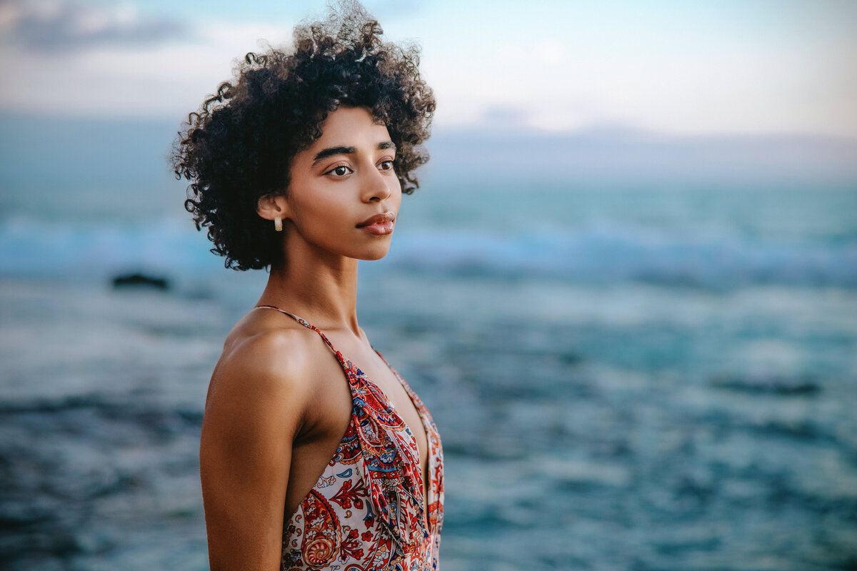 beautiful girl with ocean behind her