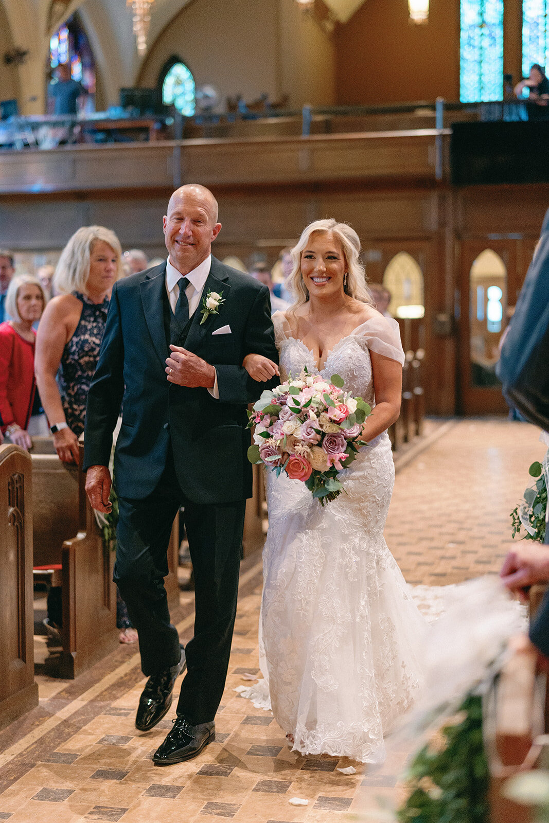 Bride walking down the aisle with her father at Memorial Presbyterian Church in St. Louis