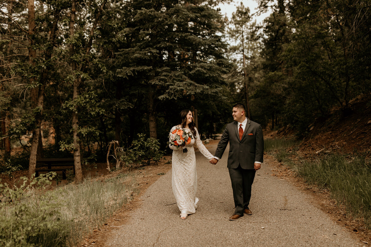 bride and groom walking together in New Mexico