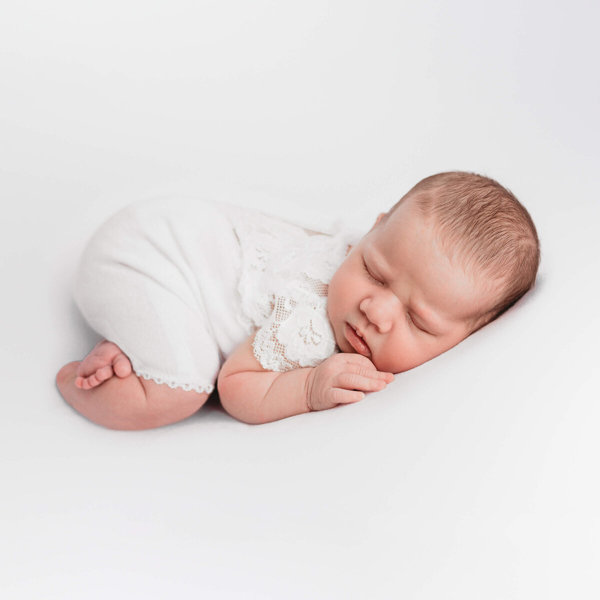 Sleeping baby girl posed for newborn photography session with Lauren Vanier Photography in Hobart, Tasmania