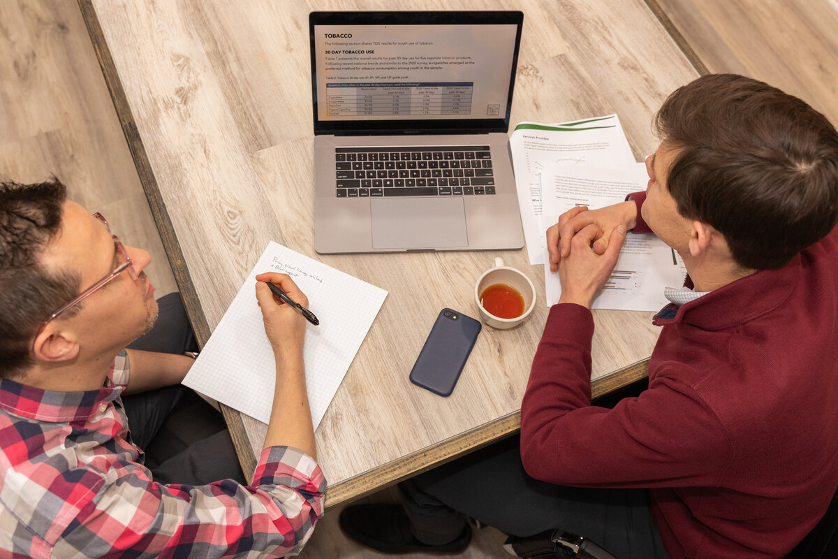 Financial advisor during a meeting with a client from above