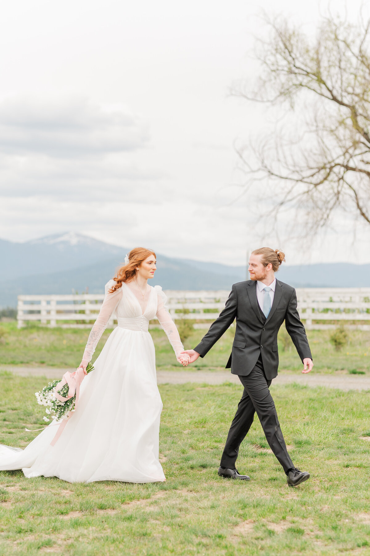 bride and groom share a moment in a tulip field the farmhouse at greenbluff in spokane washington