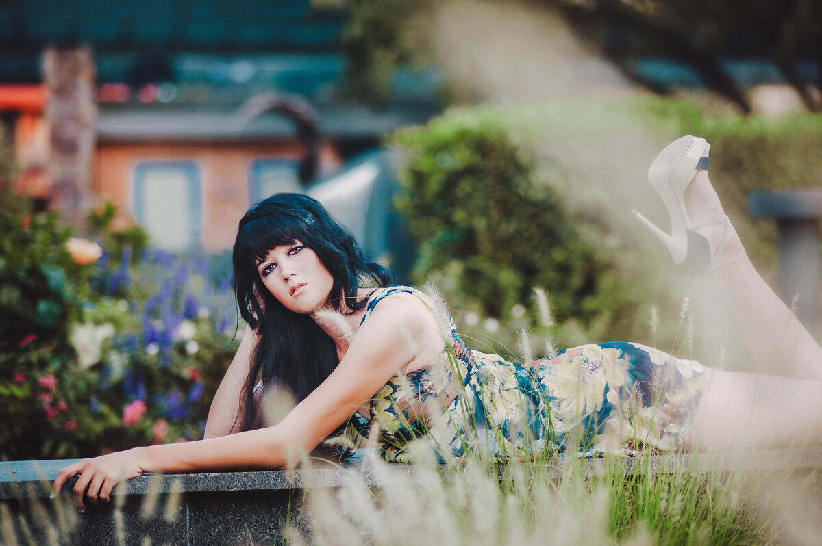 Woman posing outdoors in a floral dress during a styled portrait session in Winter Garden, Florida.