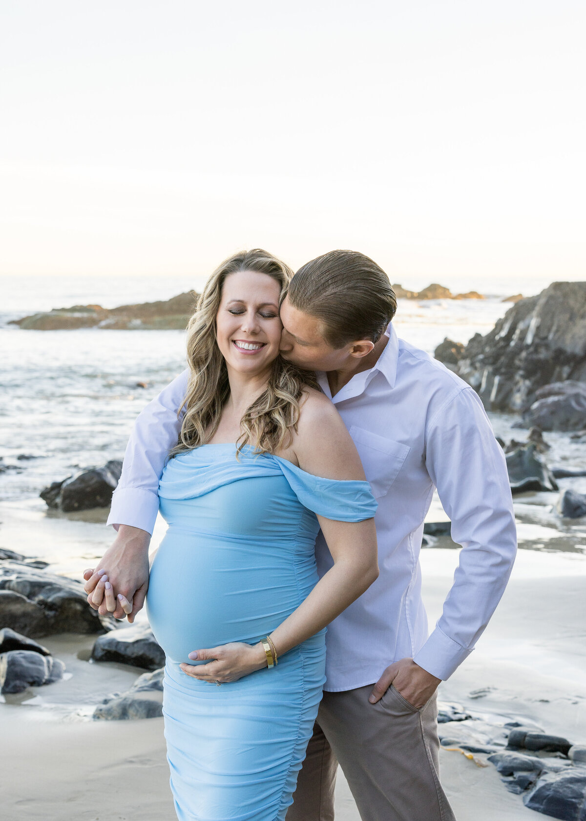 romantic maternity photo on the beach