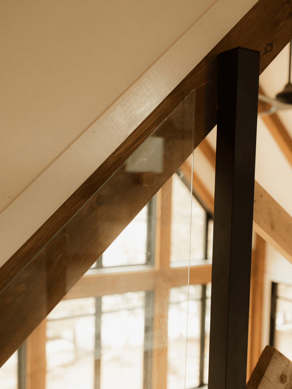 Luxury custom-built home in Haliburton Highlands showcasing stone accents, timber beams, and precise craftsmanship.