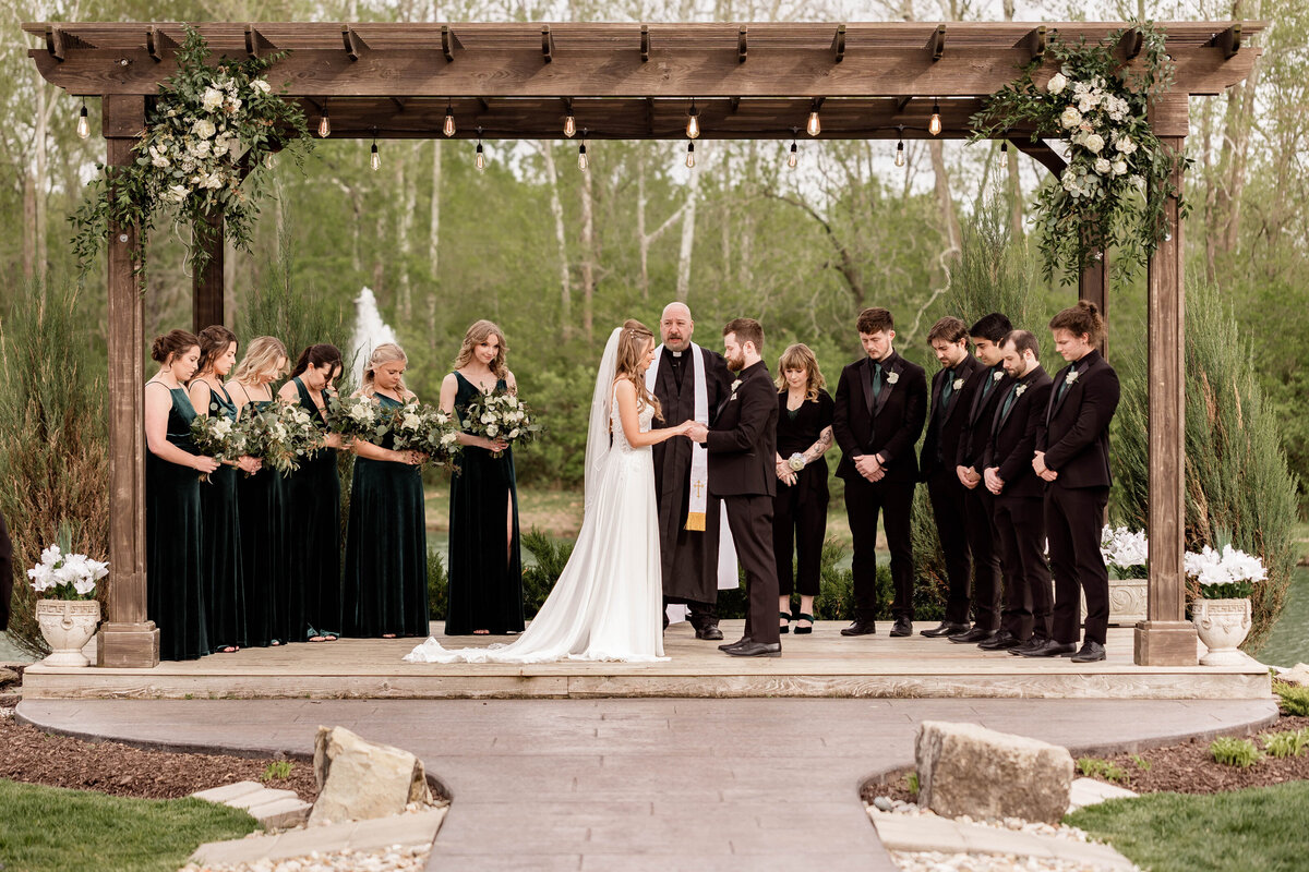 Emotional ceremony prayer captured by Style & Grace Photography at Piazza Messina in St. Charles, MO, highlighting a sacred moment during the couple’s wedding ceremony.