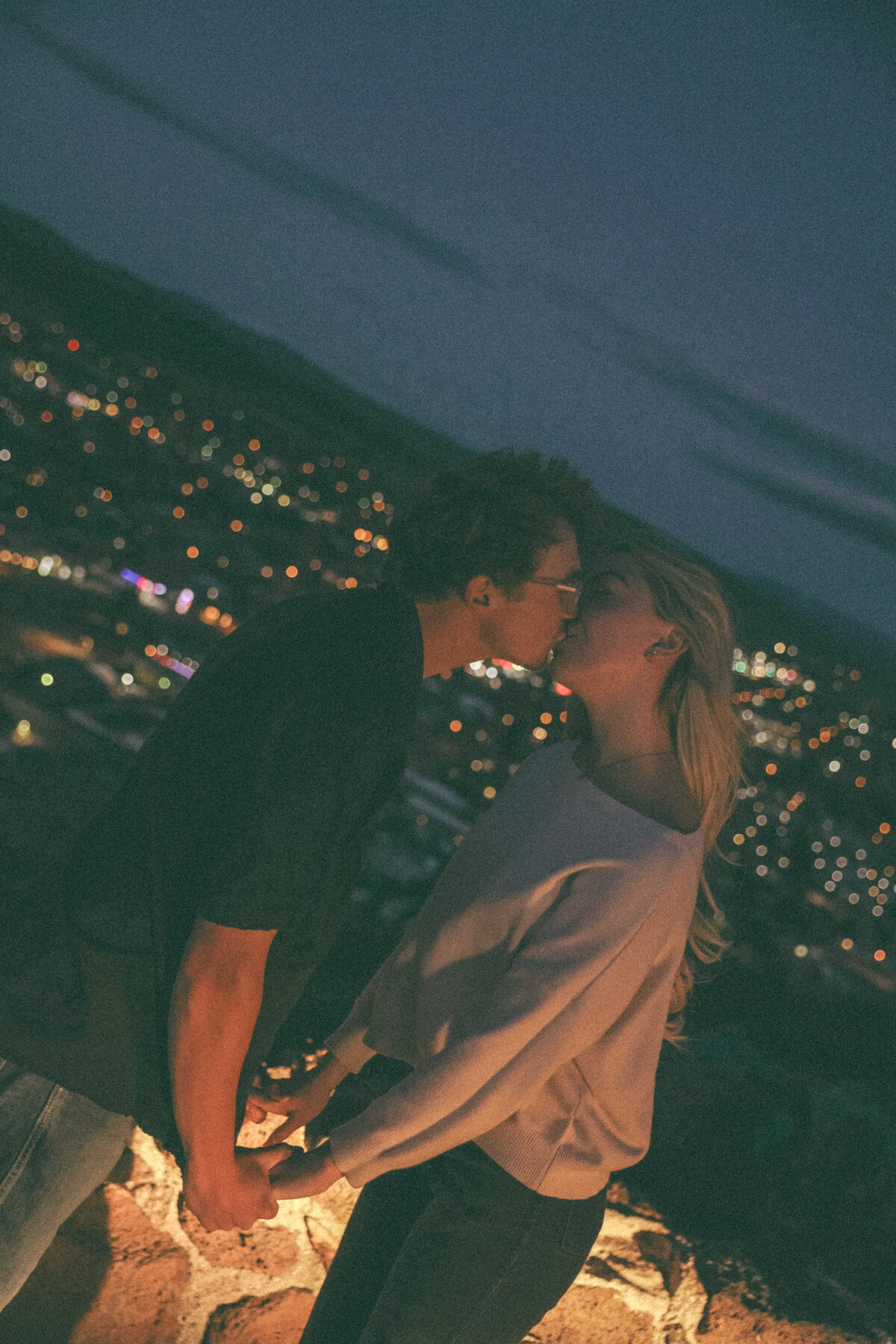 Romantic Nighttime Kiss Overlooking Oregon City Lights