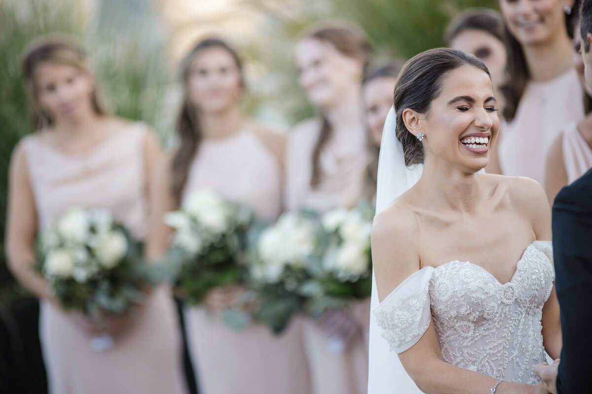 A bride laughs during her ceremony at a Tribeca Rooftop wedding in Manhattan