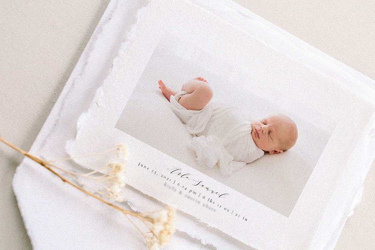 Fine art birth announcement featuring newborn portrait on handmade paper, captured by Andrea Krey Photography
