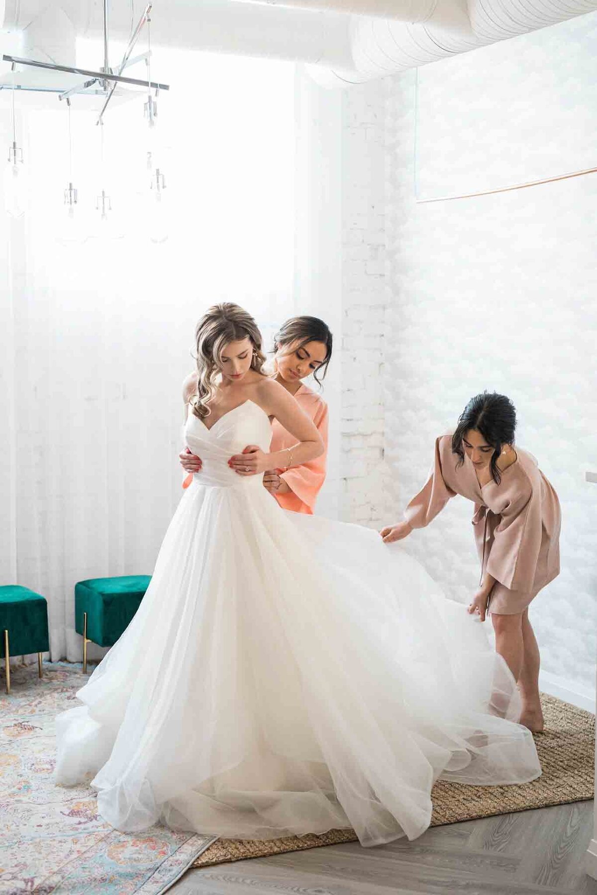 Bride getting ready at Venue 308, a historical warehouse wedding venue in Calgary, featured on the Brontë Bride Vendor Guide.