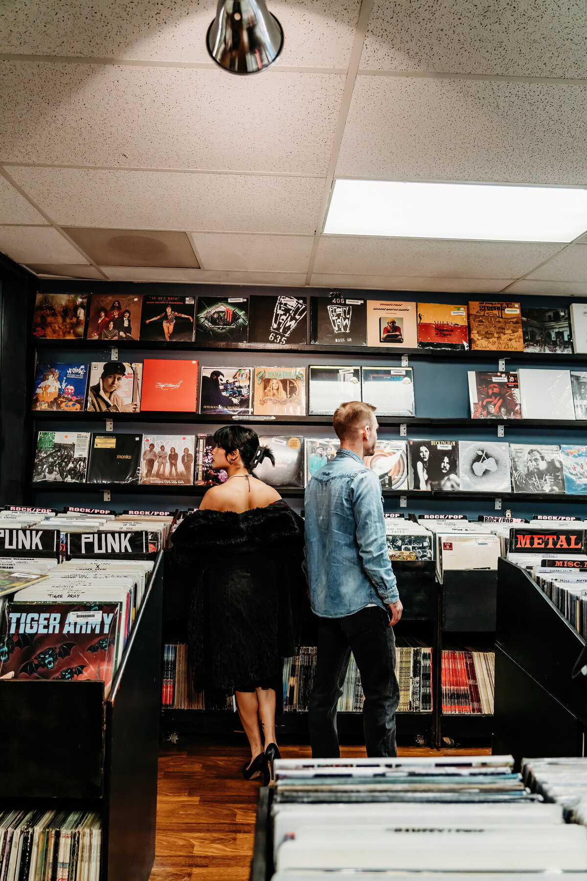 couple in a record store looking at records