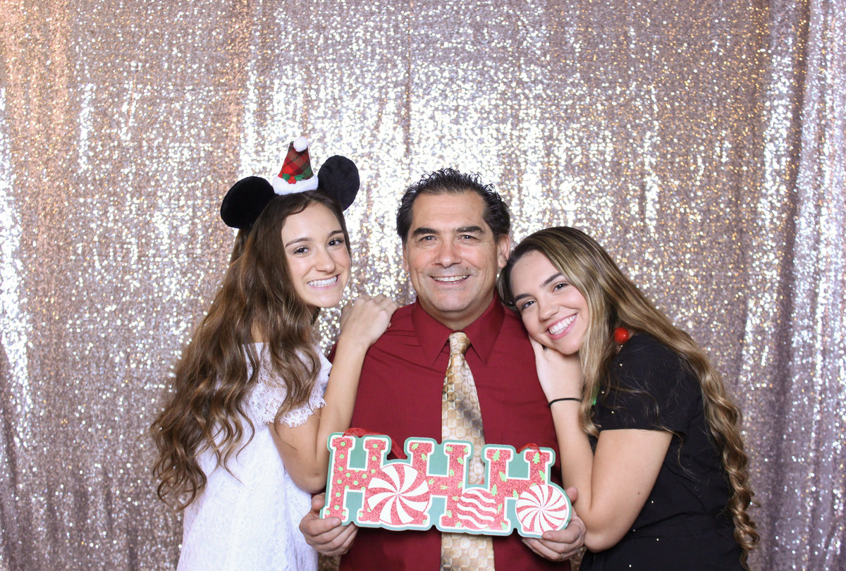 Family members celebrate the holidays with a photo booth rental