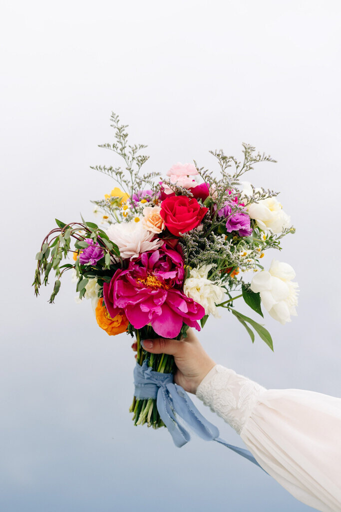 Colourful and vibrant bridal bouquet, captured by Lorissa Lee Photography. Featured on Brontë Bride.