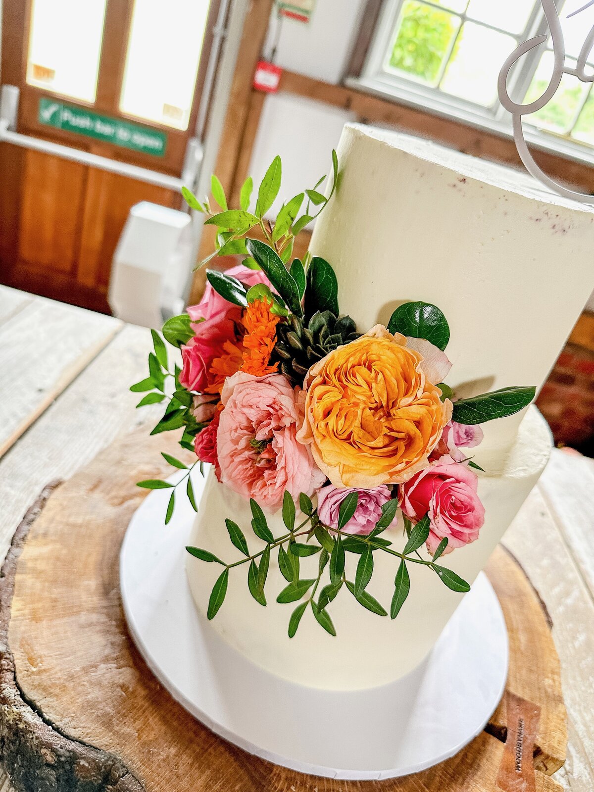 layers-graces-two-tier-buttercream-cake-semi-naked-milling-barn-fresh-flowers