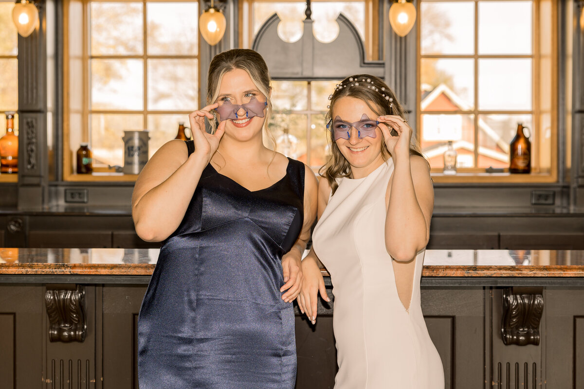bride and bridesmaid at Crooked Willow wedding venue in Osakis MN