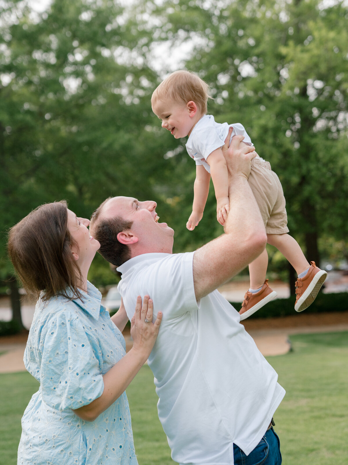 Fall family session at Lake Peachtree. Family holding hands.