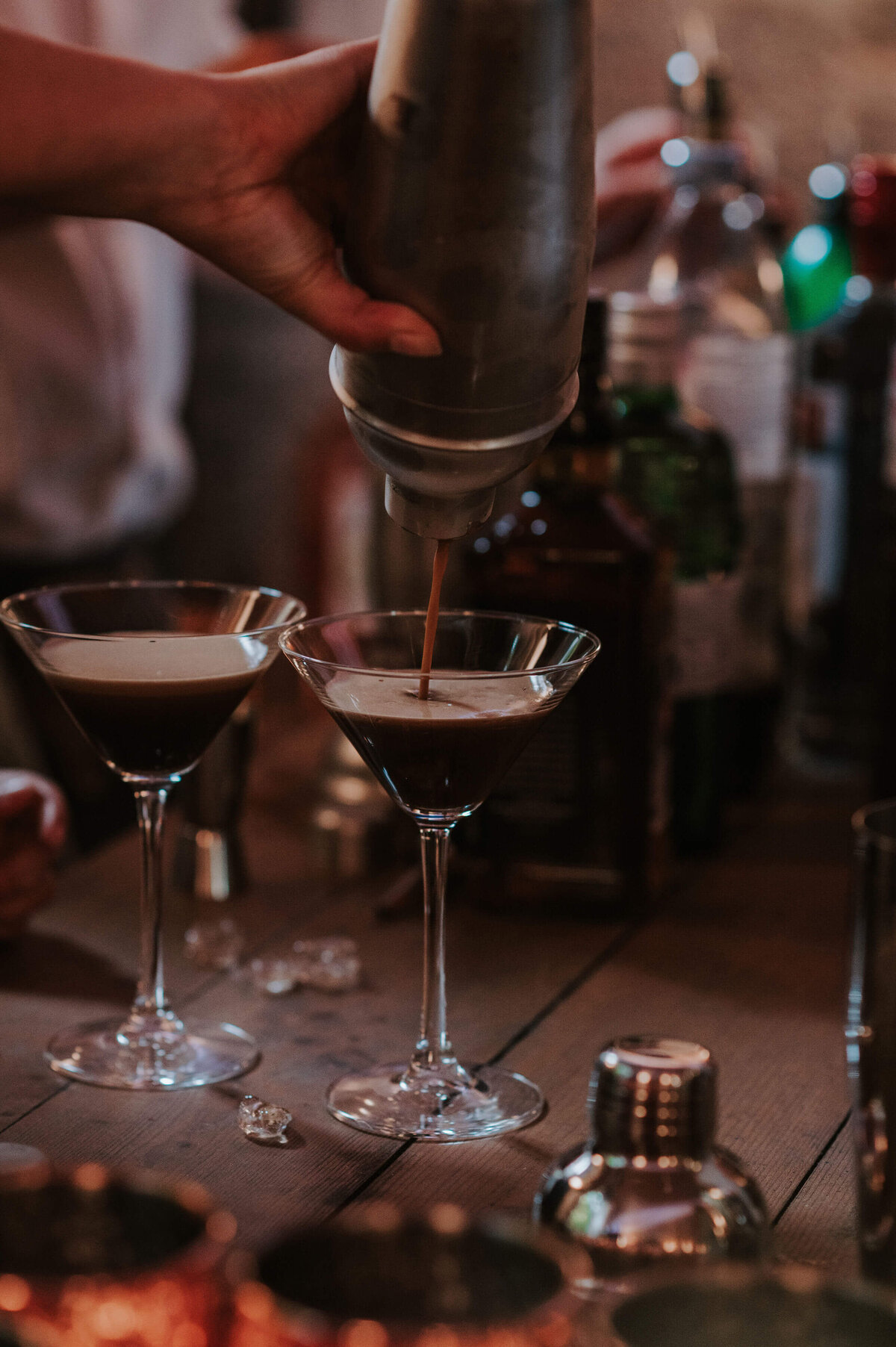 Espresso martinis being poured from a cocktail shaker