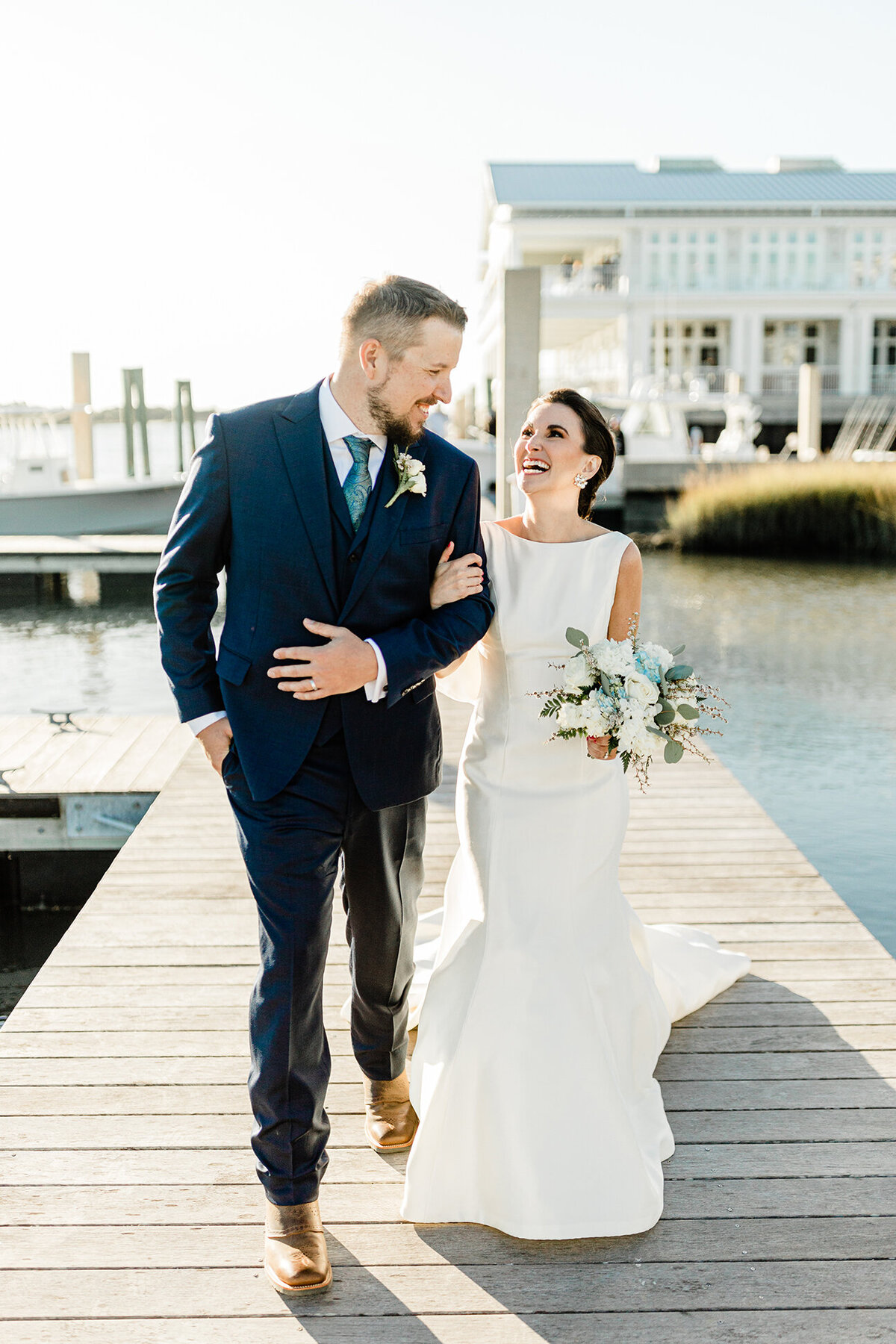 Dockside wedding photos never looked so good! walking down the dock these two took our breath away.