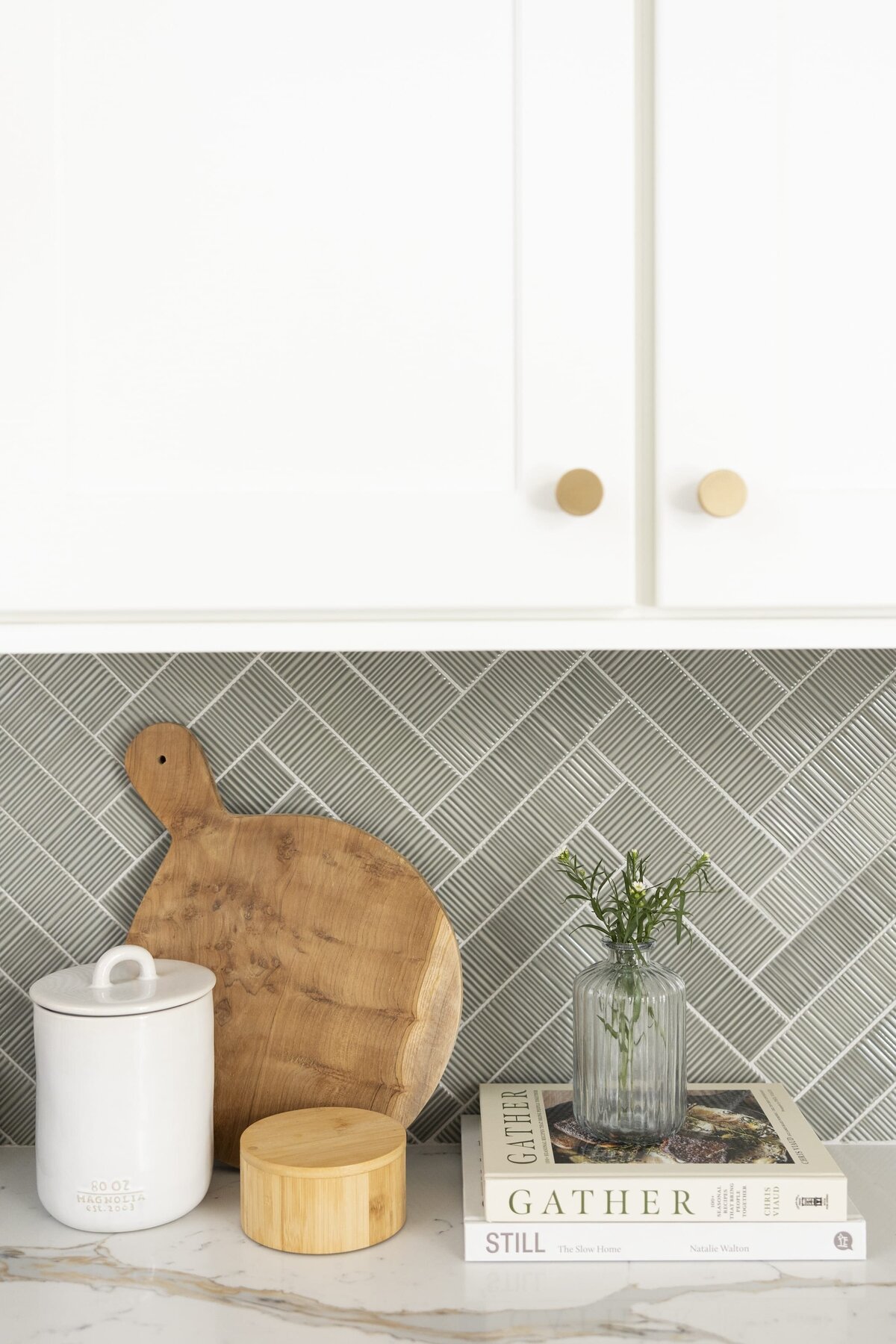 dewine design orlando interior designer belle isle herringbone backsplash with wooden round cutting board