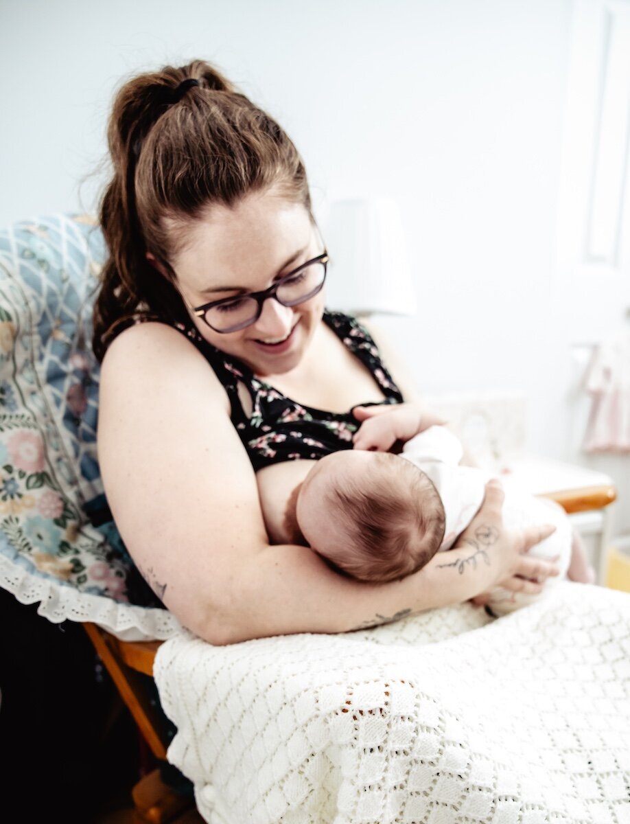 A new mom breastfeeds her two day old baby in her Edmonton home