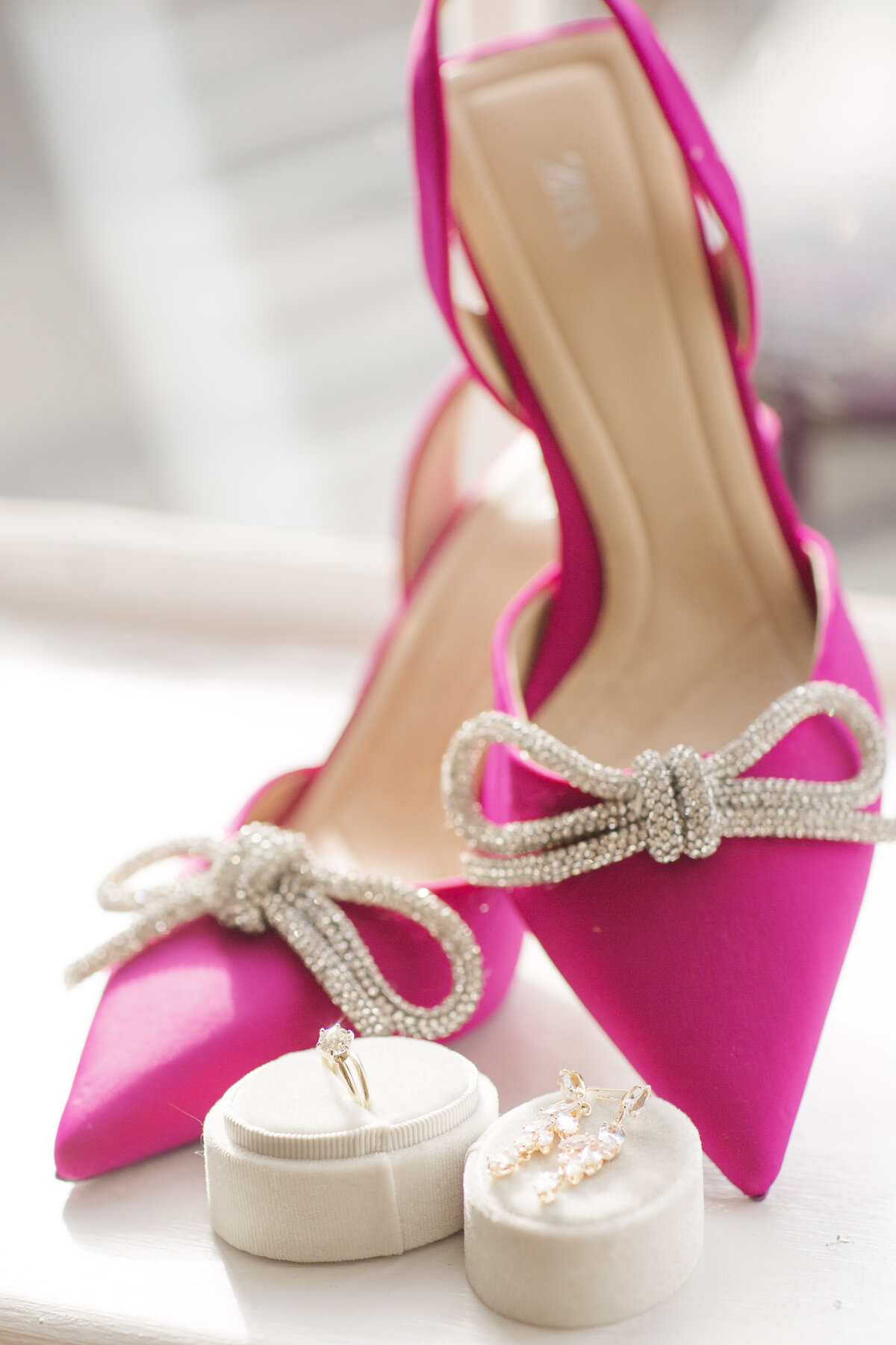 Bright pink shows with silver bows