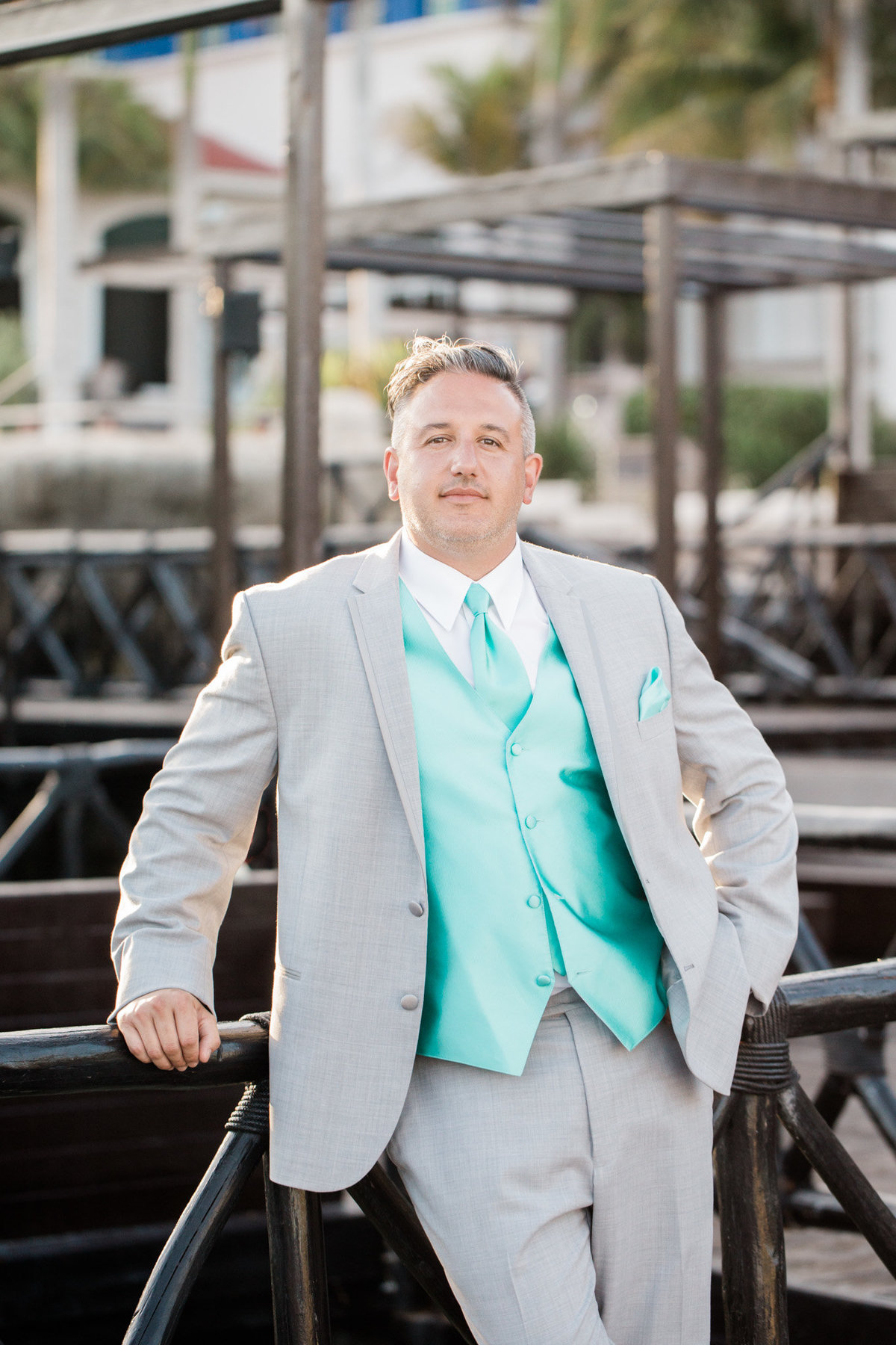 Classic groom portraits at a stunning destination.  Photo by Rebecca Cerasani.