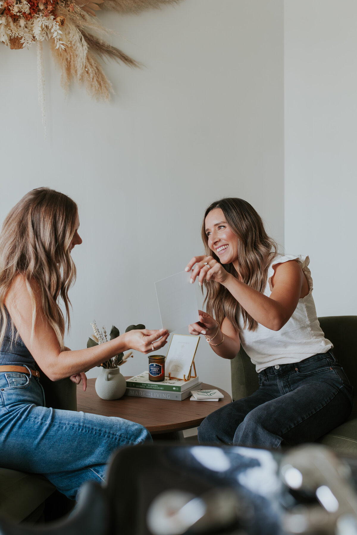 hairstylist-giving-slight-education-in-salon-for-brand-session-south-charlotte