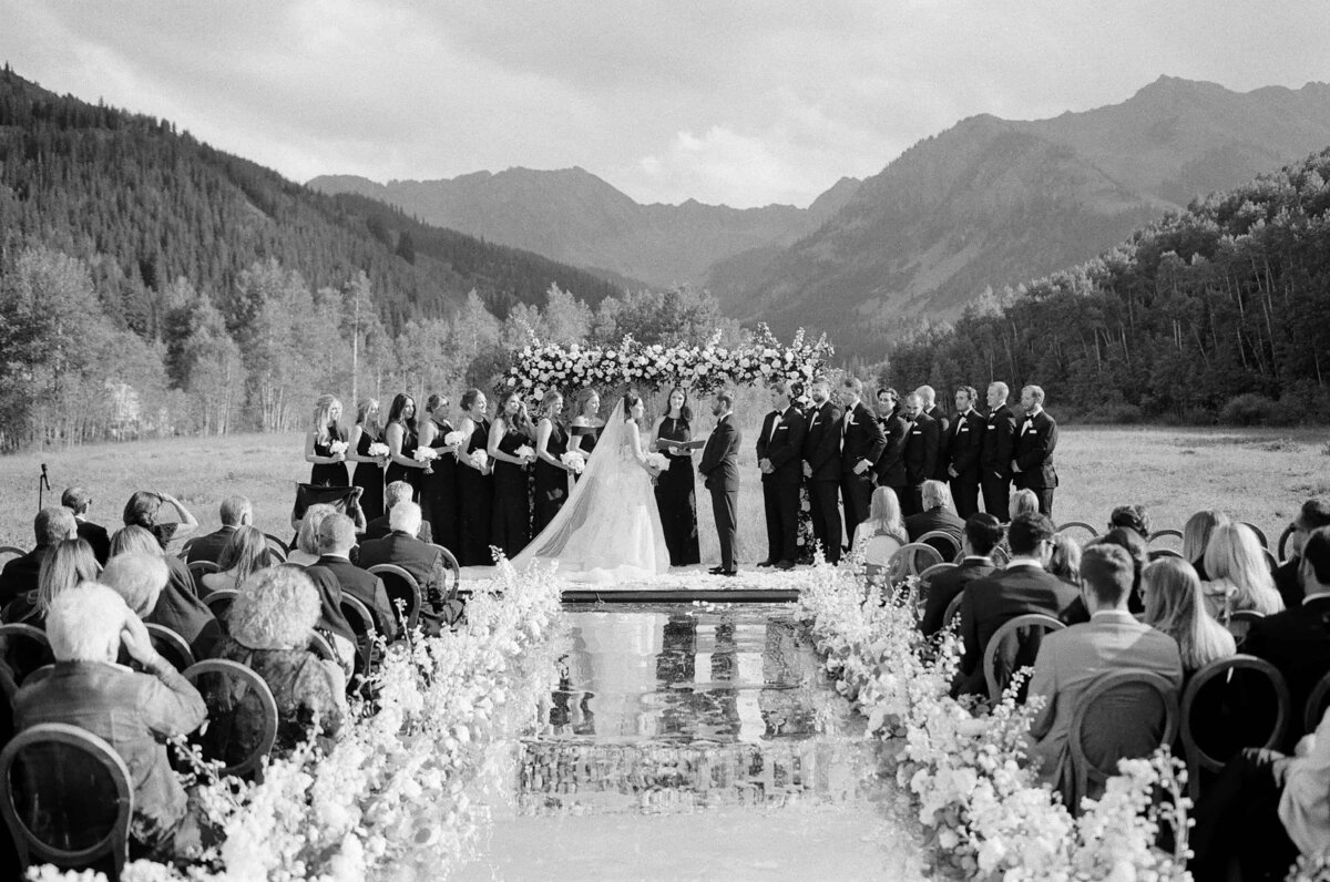 Black and white photo of an outdoor wedding ceremony in Aspen Colorado