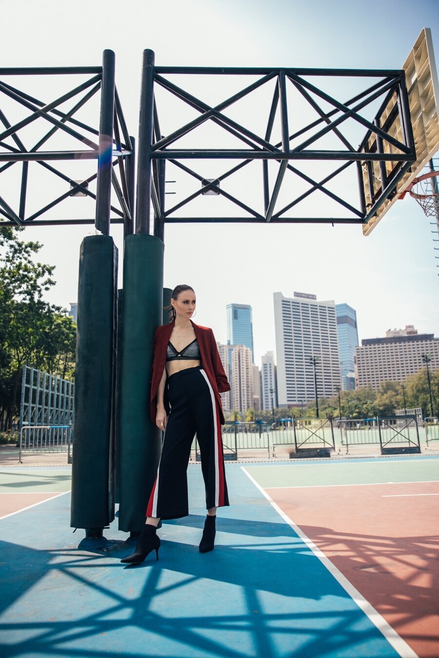 Picture of girl standing under a basketball net