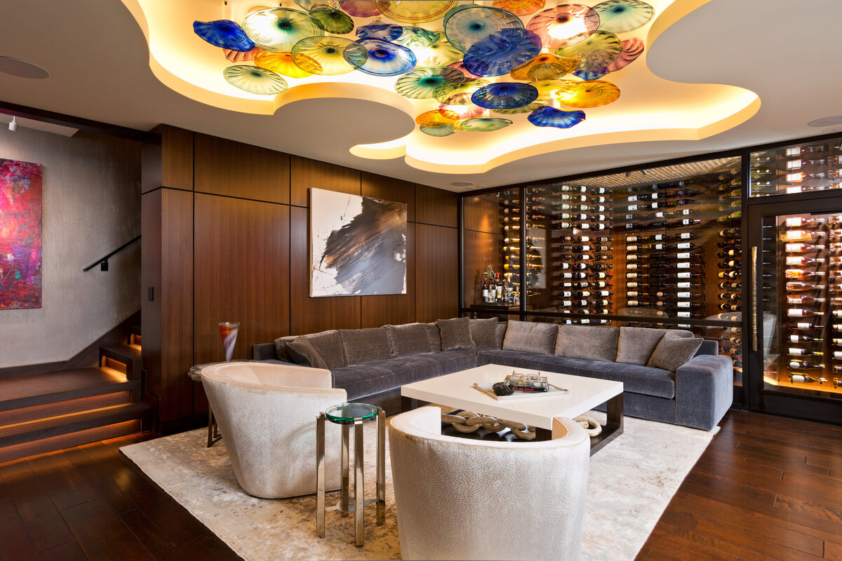 living room with wine filled accent wall