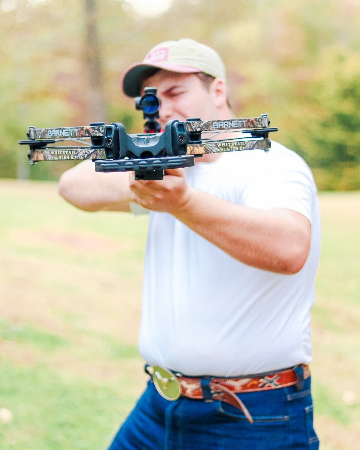 senior guy shooting his bow