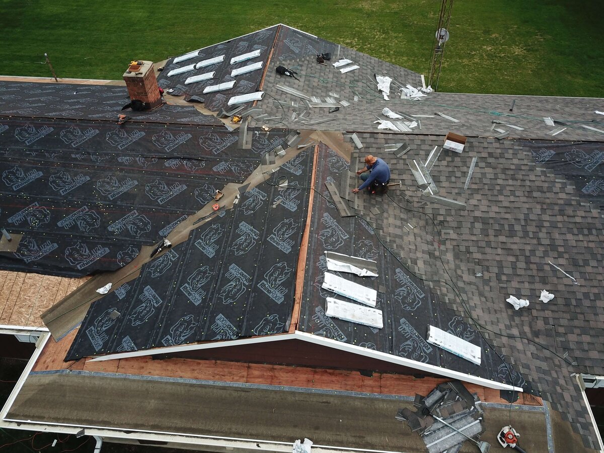 Roof underlayment installation in progress for a residential roofing project by Black Bear Roofing.