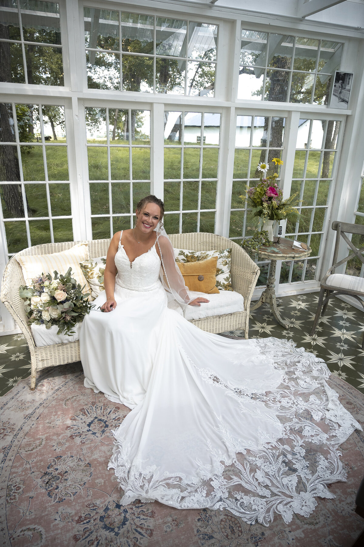 Groom watching bride walk aisle