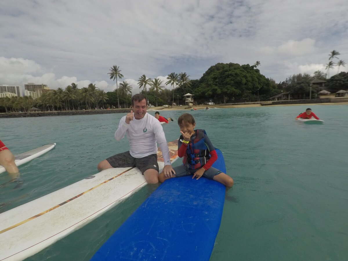 Father and son taking a breather between waves. Salt in the air, sunshine on deck, and nothing but good vibes and surf lessons ahead. 🏄‍♂️🤙

