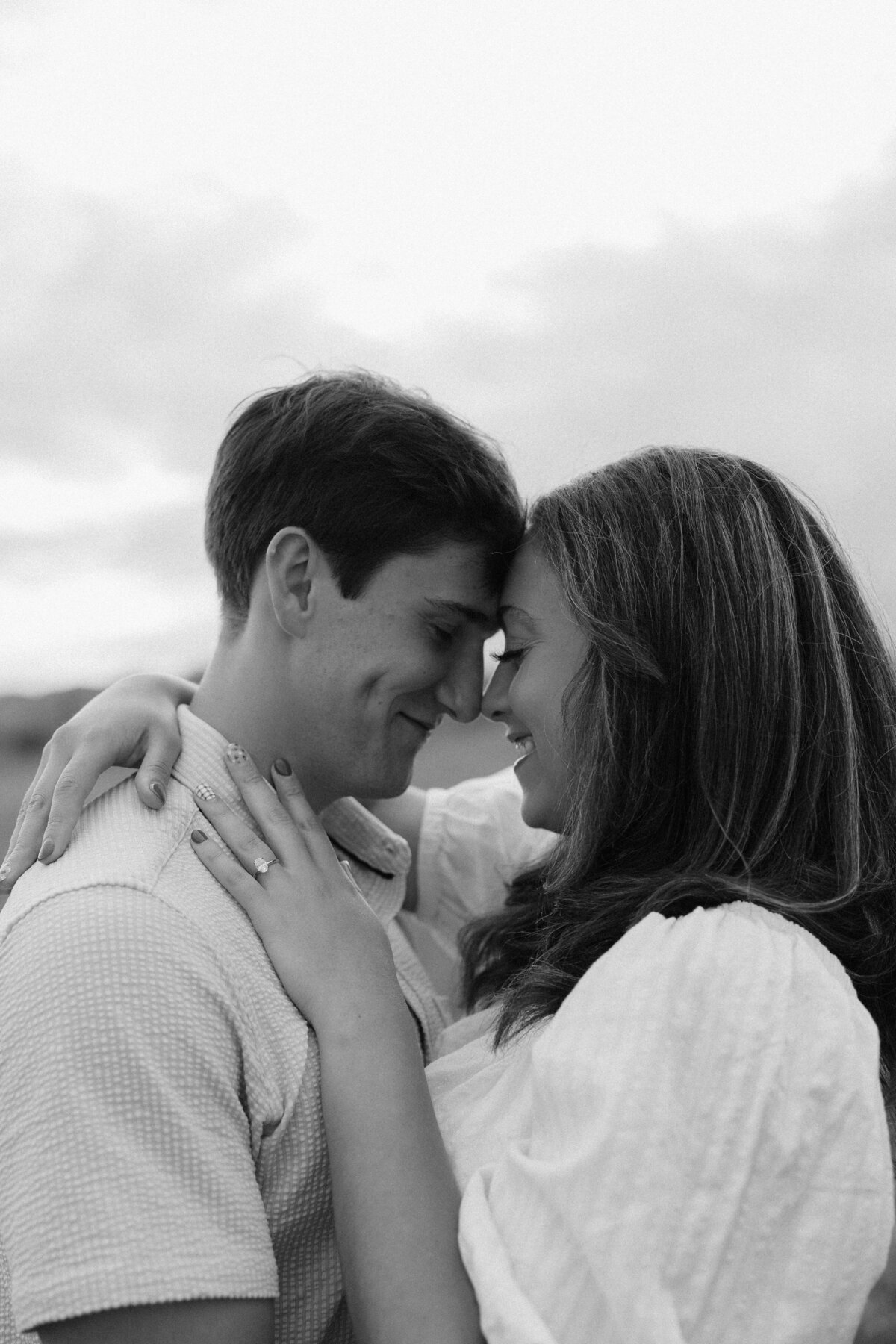 Olivia and Christian standing forehead to forehead at their Wind Cave National Park Engagement Session.